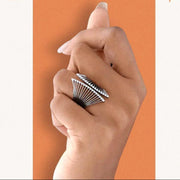 Hand holding a pen with 'Intentional' text on an orange arch against a white background
